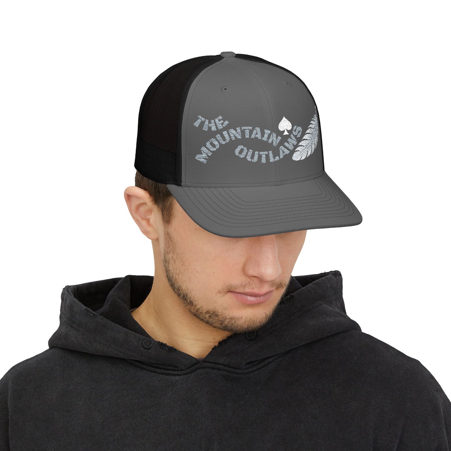 The Mountain Outlaws™ Feather & Spade Trucker Hat
