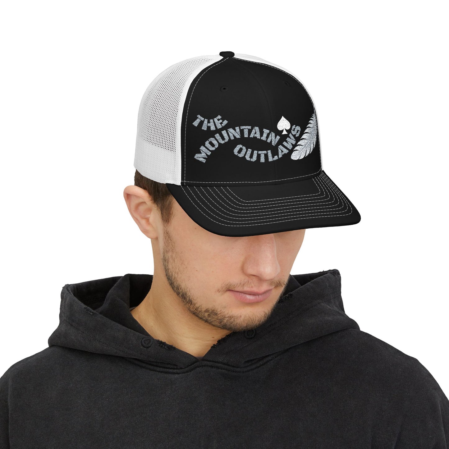 The Mountain Outlaws™ Feather & Spade Trucker Hat