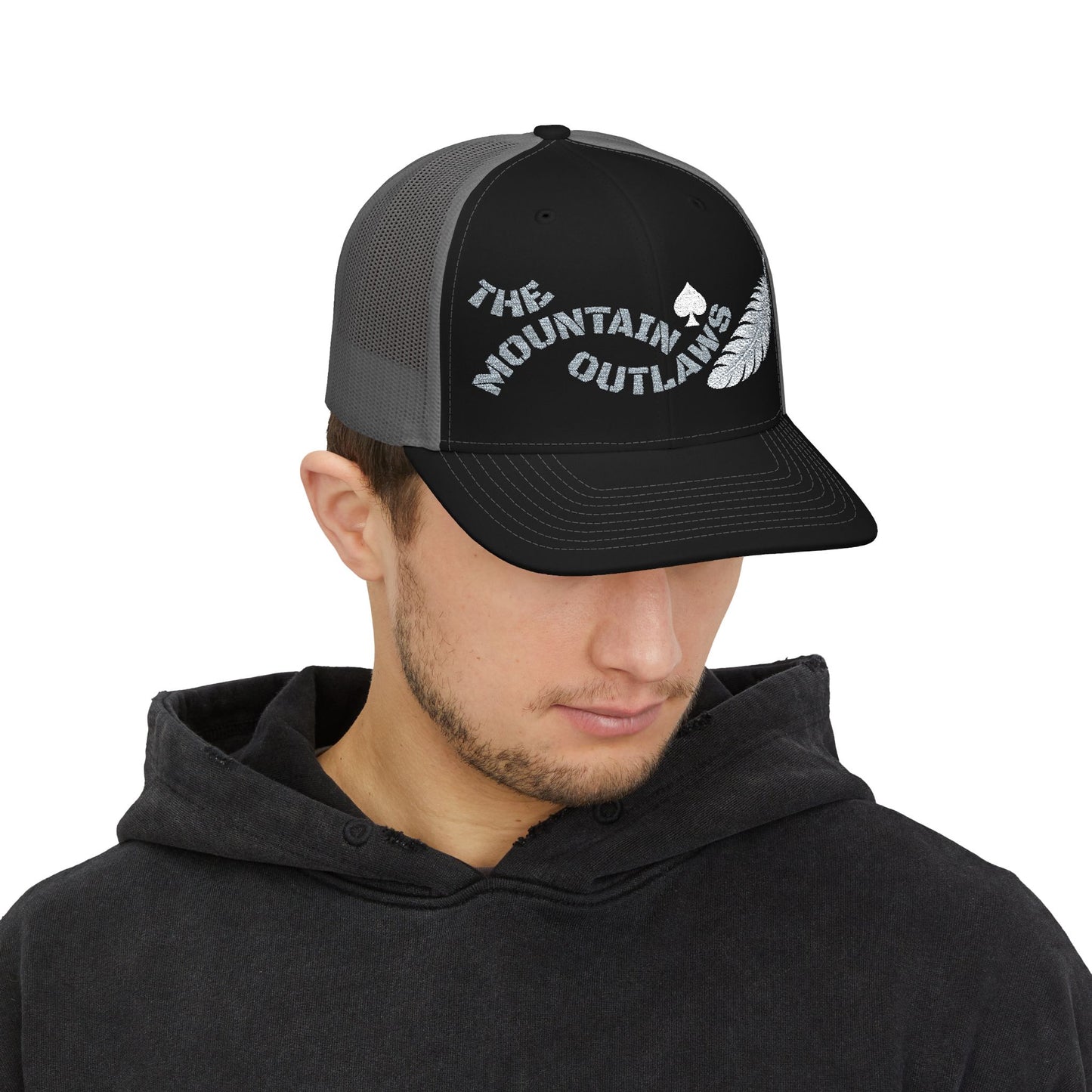 The Mountain Outlaws™ Feather & Spade Trucker Hat